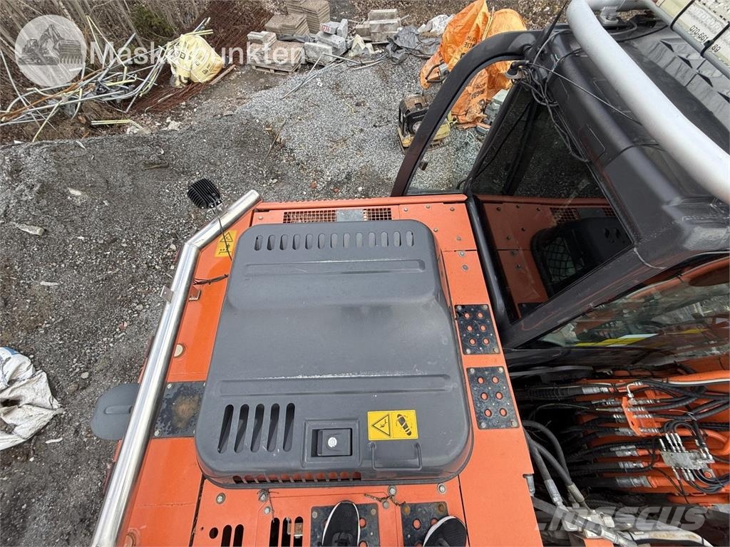 Hitachi ZX 140W-5B حفارات بعجل