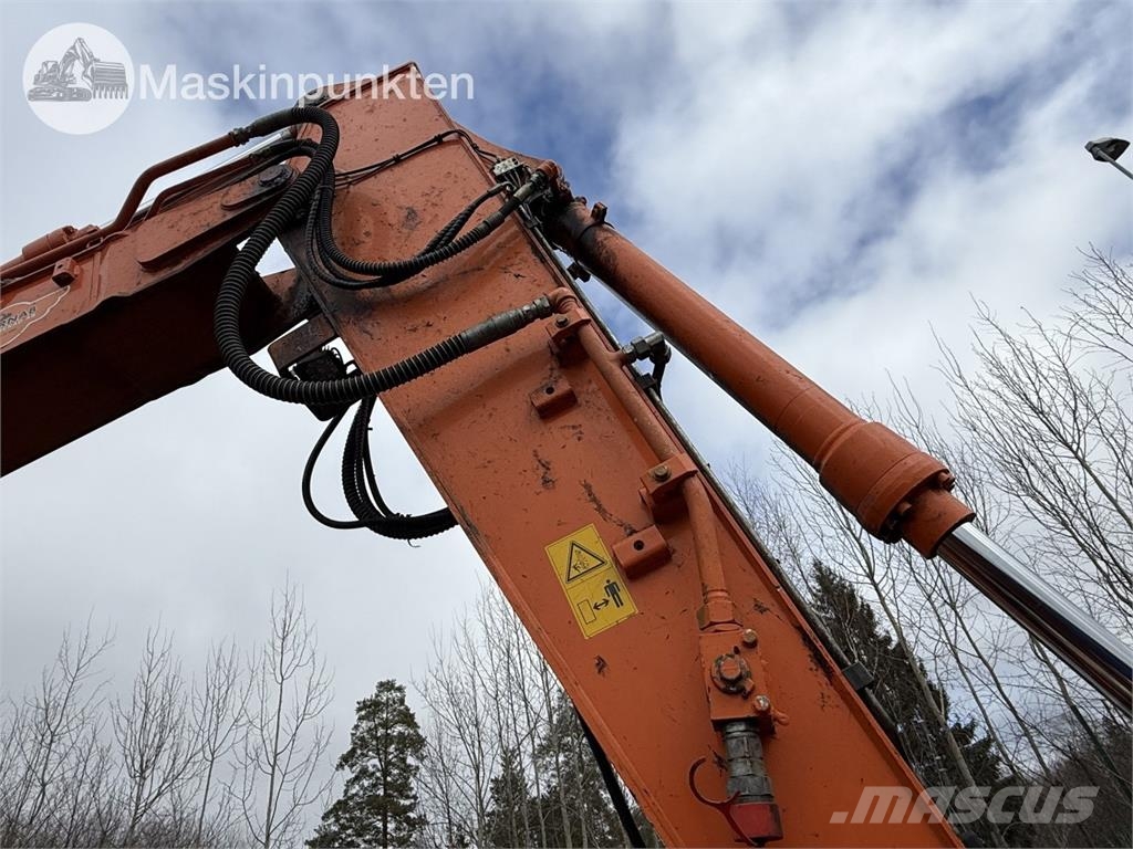 Hitachi ZX 140W-5B حفارات بعجل