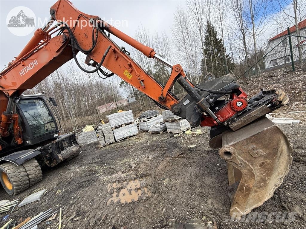 Hitachi ZX 140W-5B حفارات بعجل