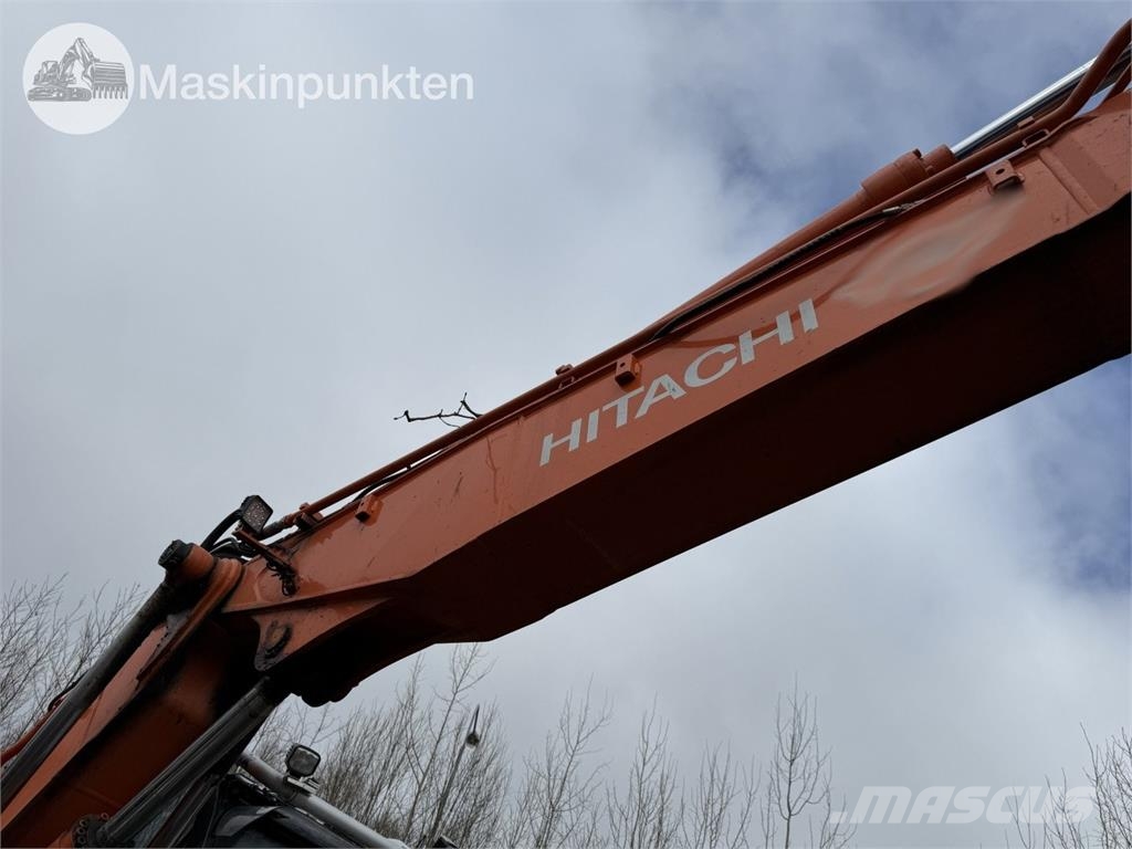 Hitachi ZX 140W-5B حفارات بعجل