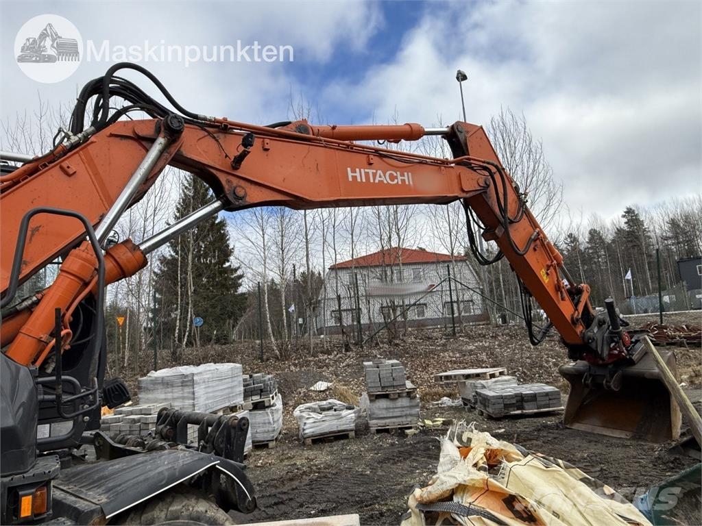 Hitachi ZX 140W-5B حفارات بعجل