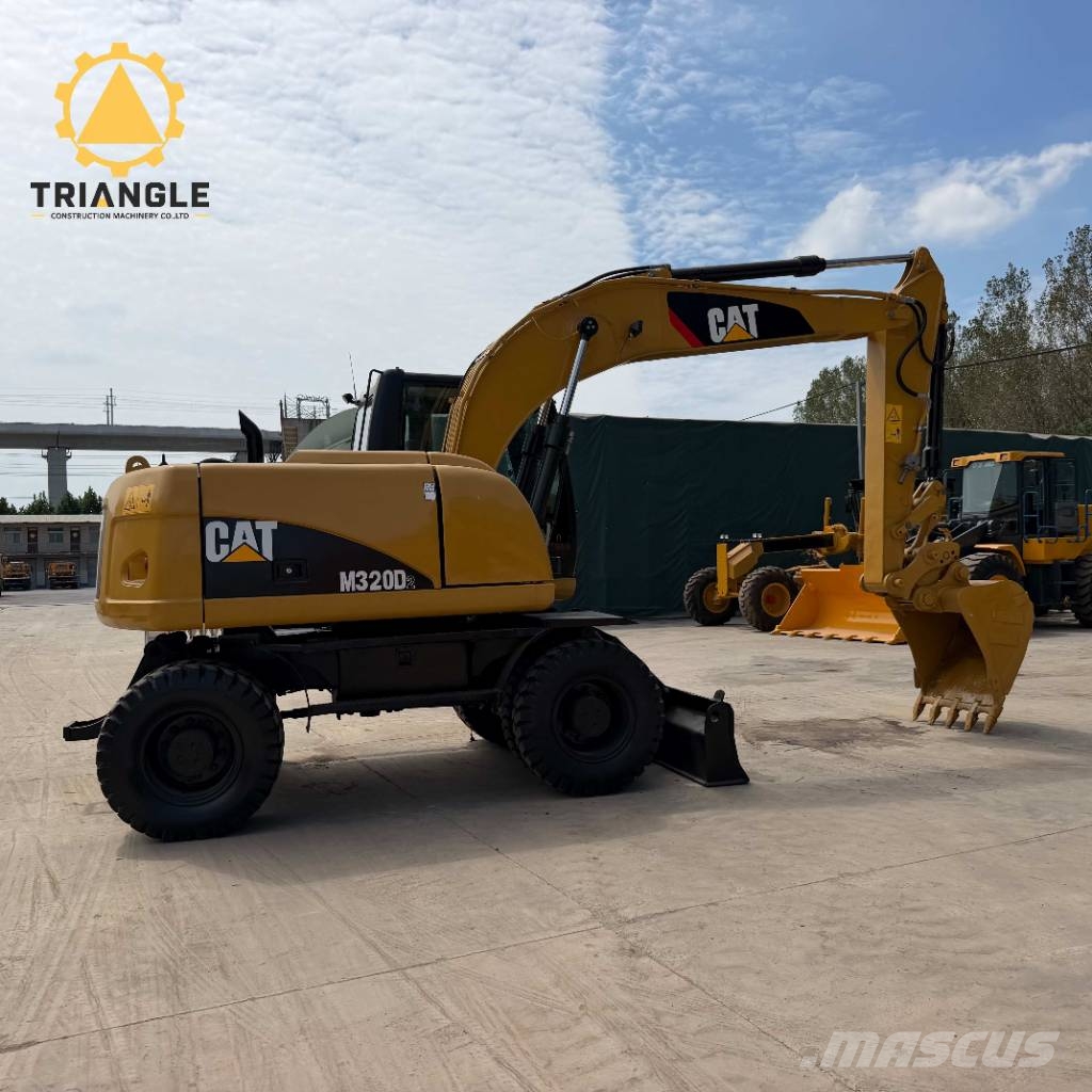CAT M320DL Ratiniai ekskavatoriai