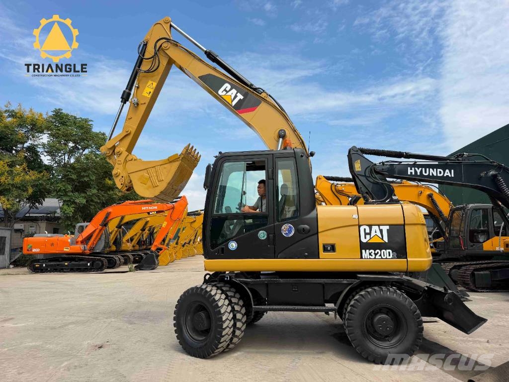 CAT M320DL Ratiniai ekskavatoriai