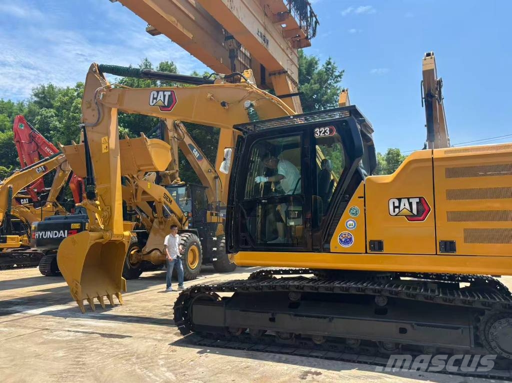 CAT 323 Bagri goseničarji