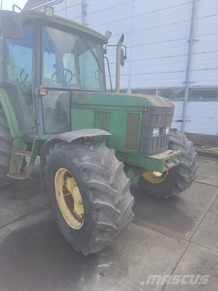 John Deere 6210    met werk Traktorit