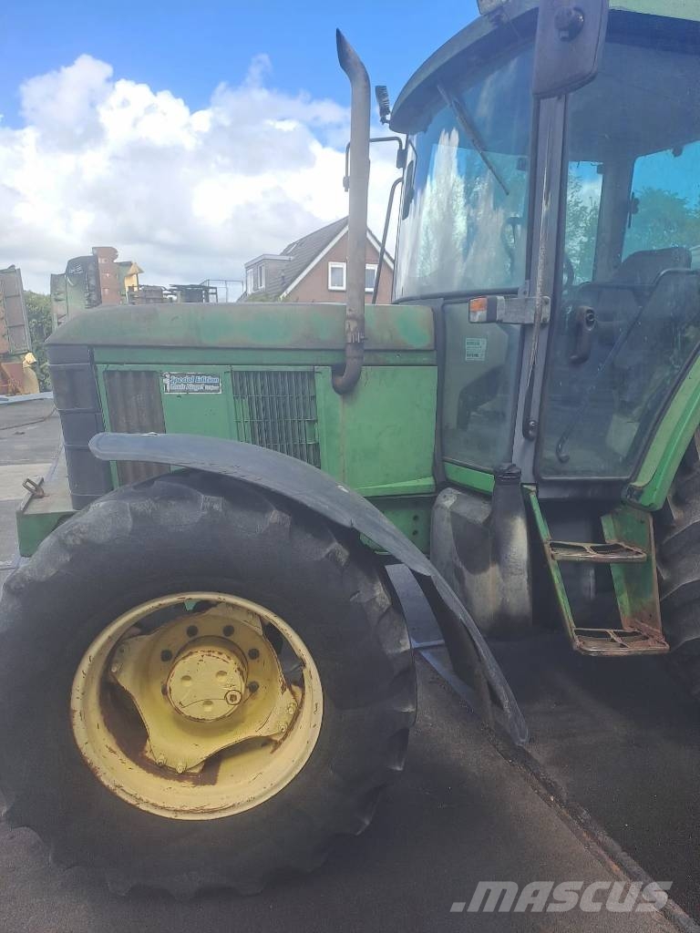John Deere 6210    met werk Traktorit