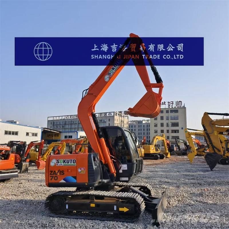 M Hitachi ZX 170 W Wheeled excavator with tipper wagon and a wheel