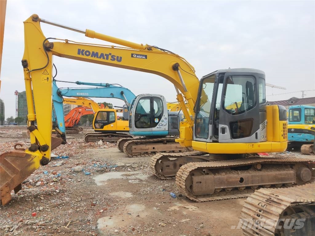Komatsu PC 128 US حفارات وسط 7 طن - 12 طن