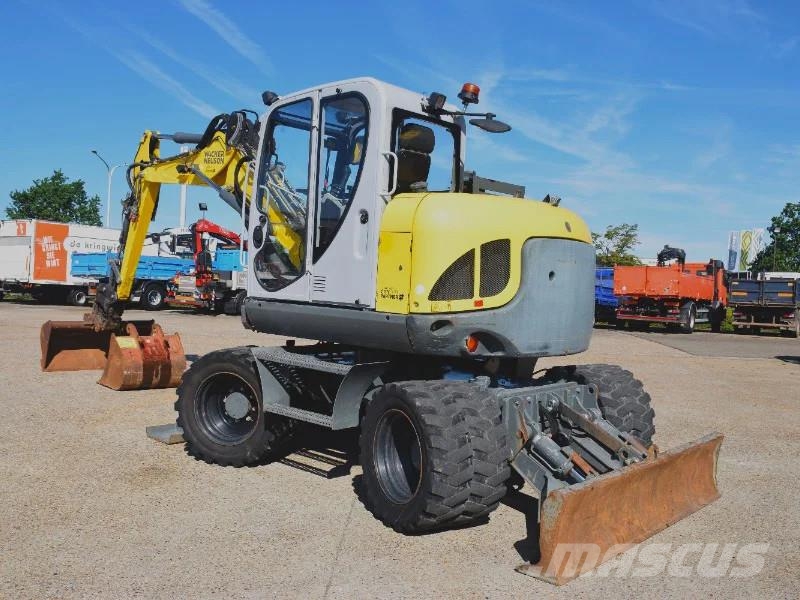 Wacker Neuson EW100 wheel-excavator Model E06-06 Midigraafmachines 7t - 12t