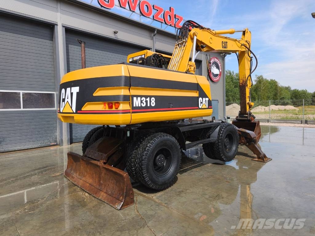 CAT M 318 Wielgraafmachines