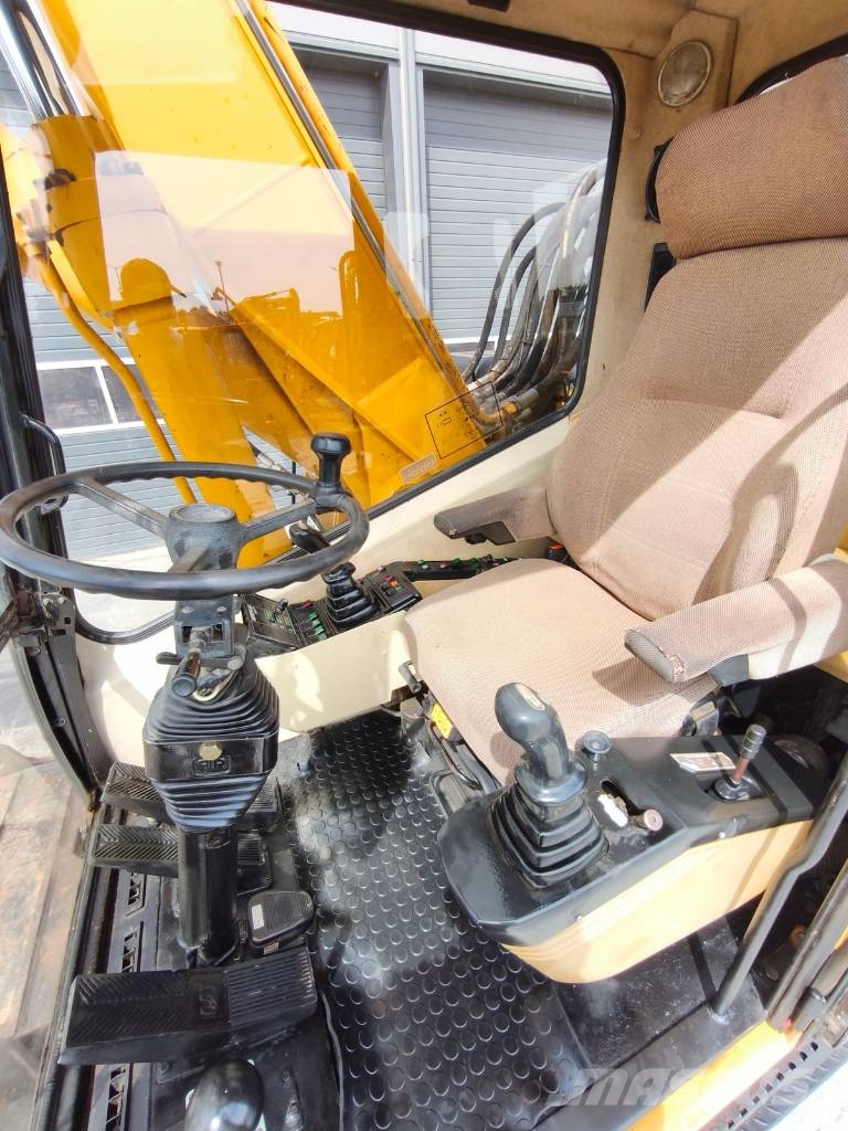 CAT M 318 Wielgraafmachines