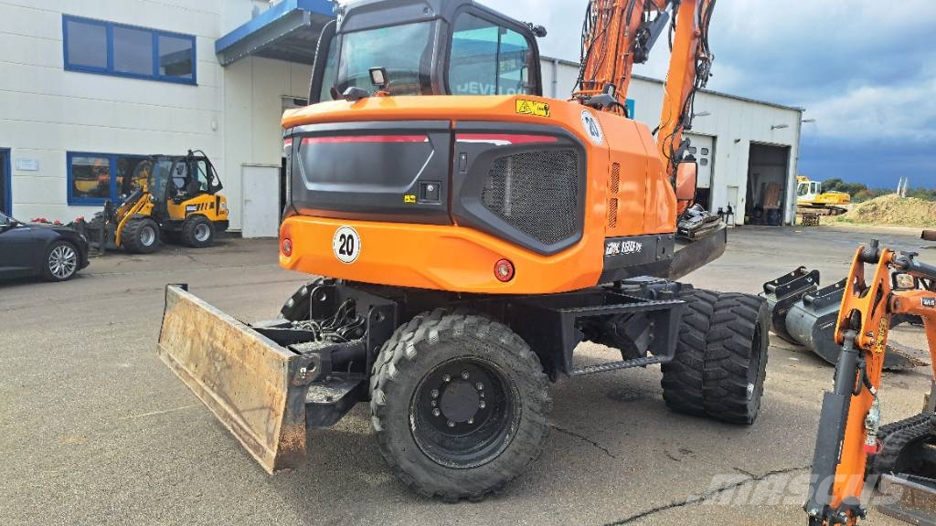 Develon DX 100 W-7 Kolová rýpadla