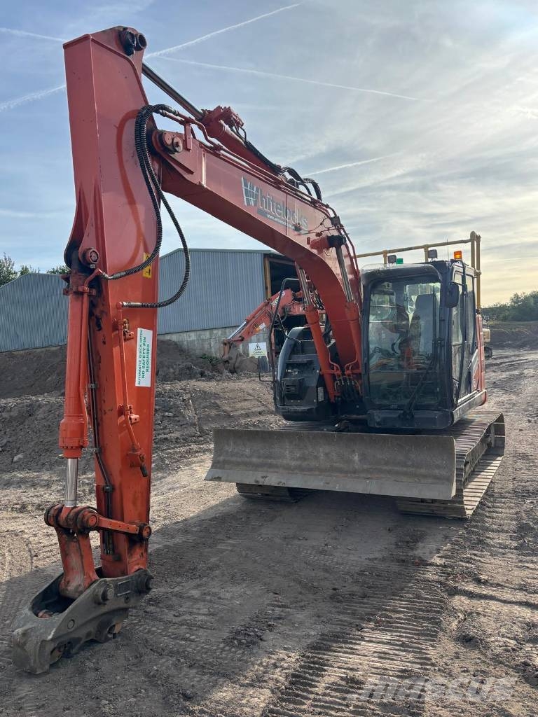 Hitachi ZX 135 US-7 حفارات زحافة