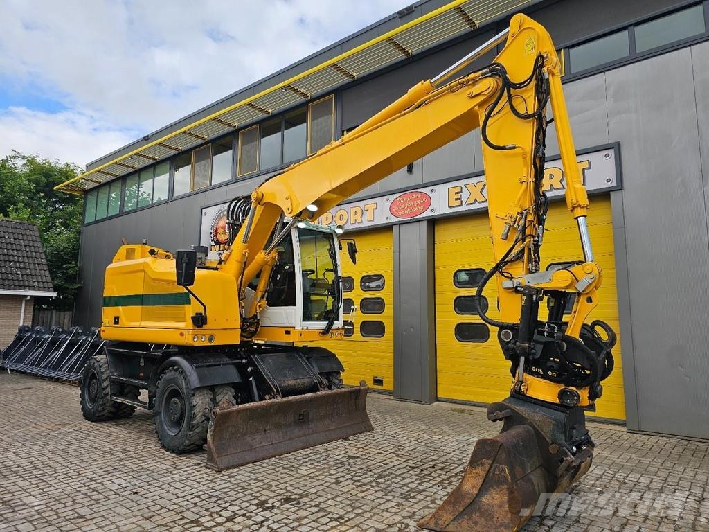 CAT M315F حفارات بعجل