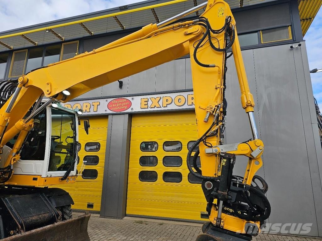 CAT M315F حفارات بعجل
