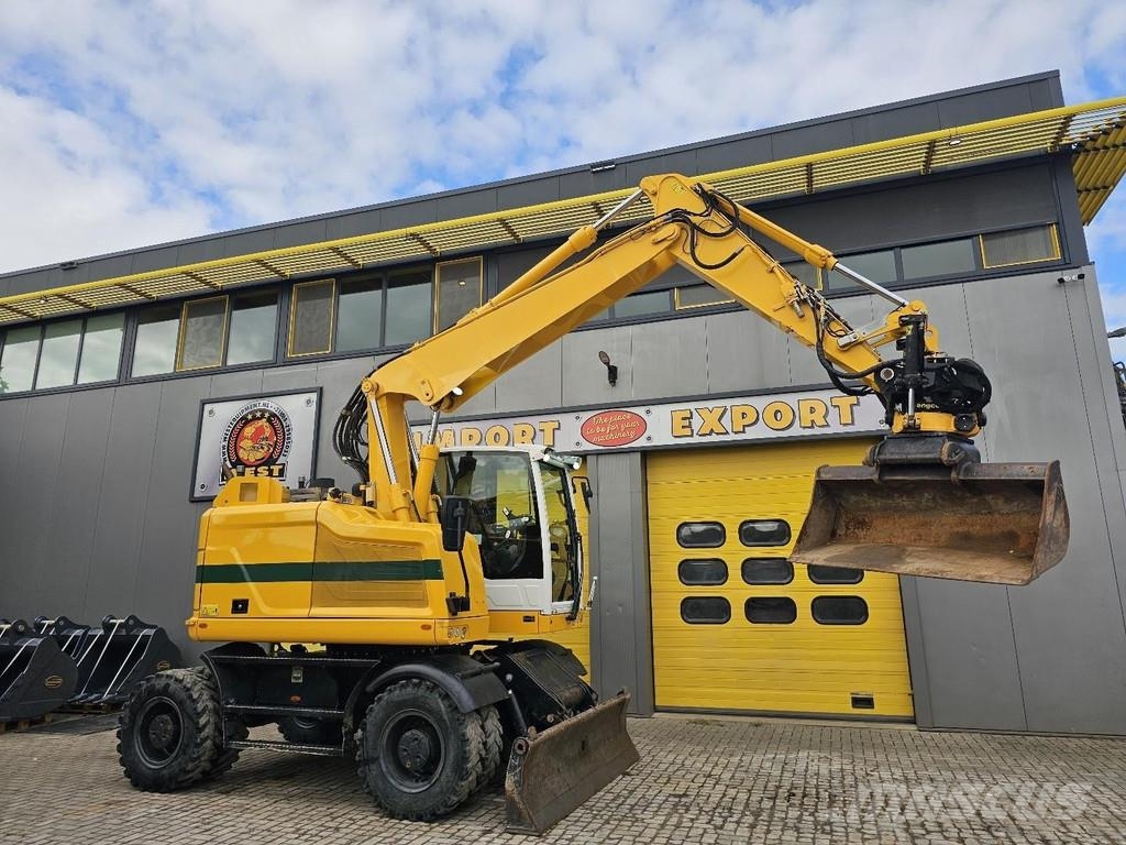 CAT M315F حفارات بعجل