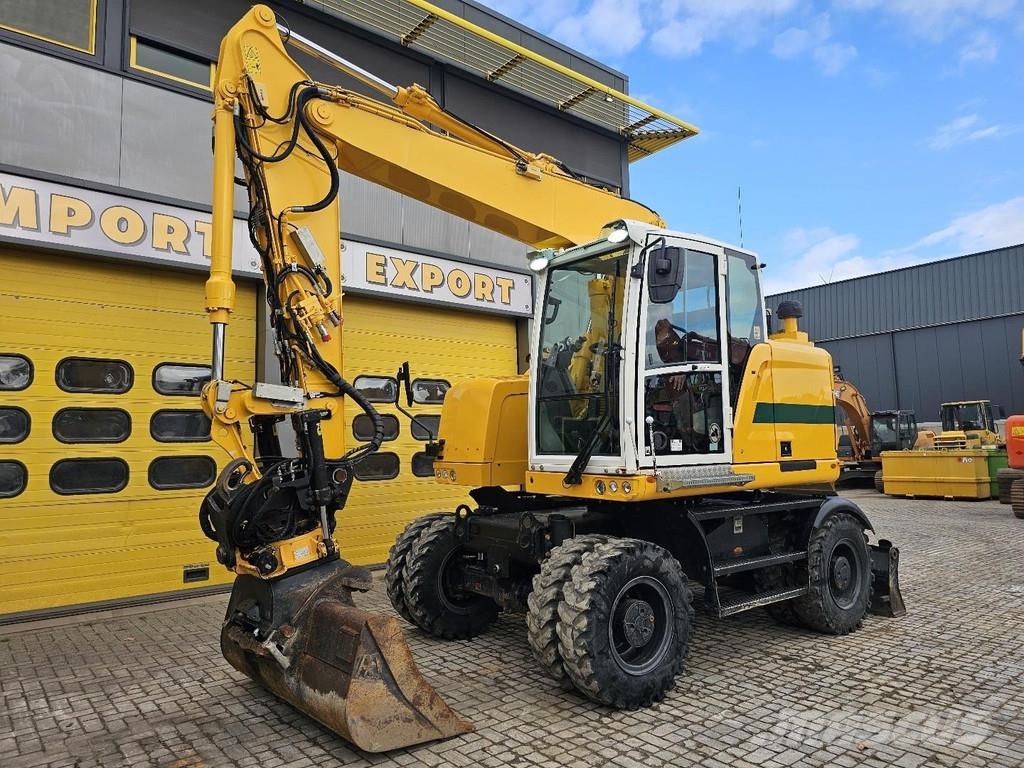 CAT M315F حفارات بعجل