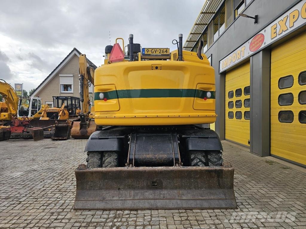 CAT M315F حفارات بعجل
