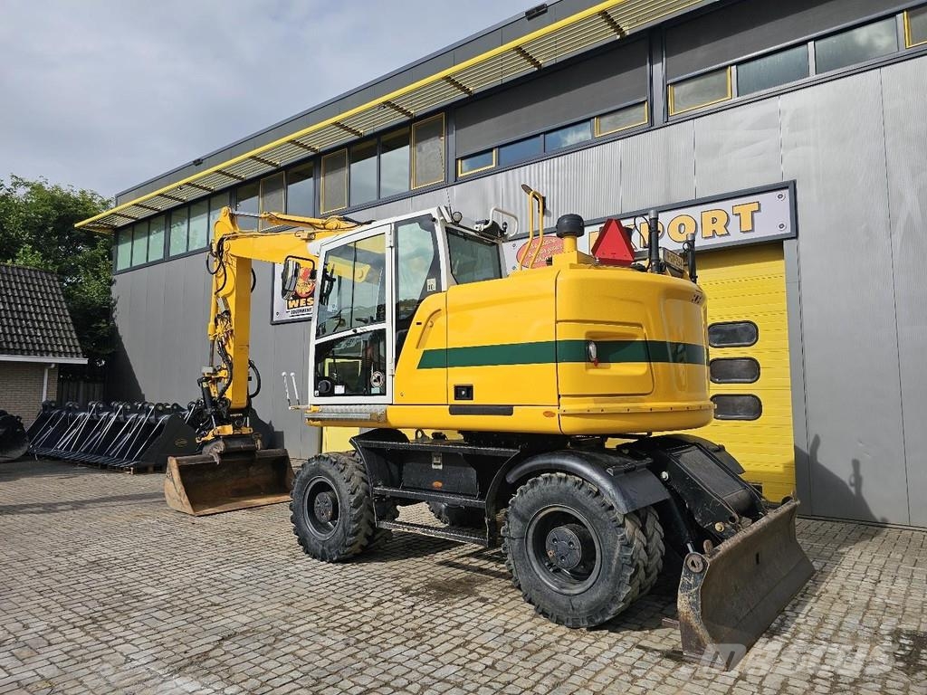 CAT M315F حفارات بعجل