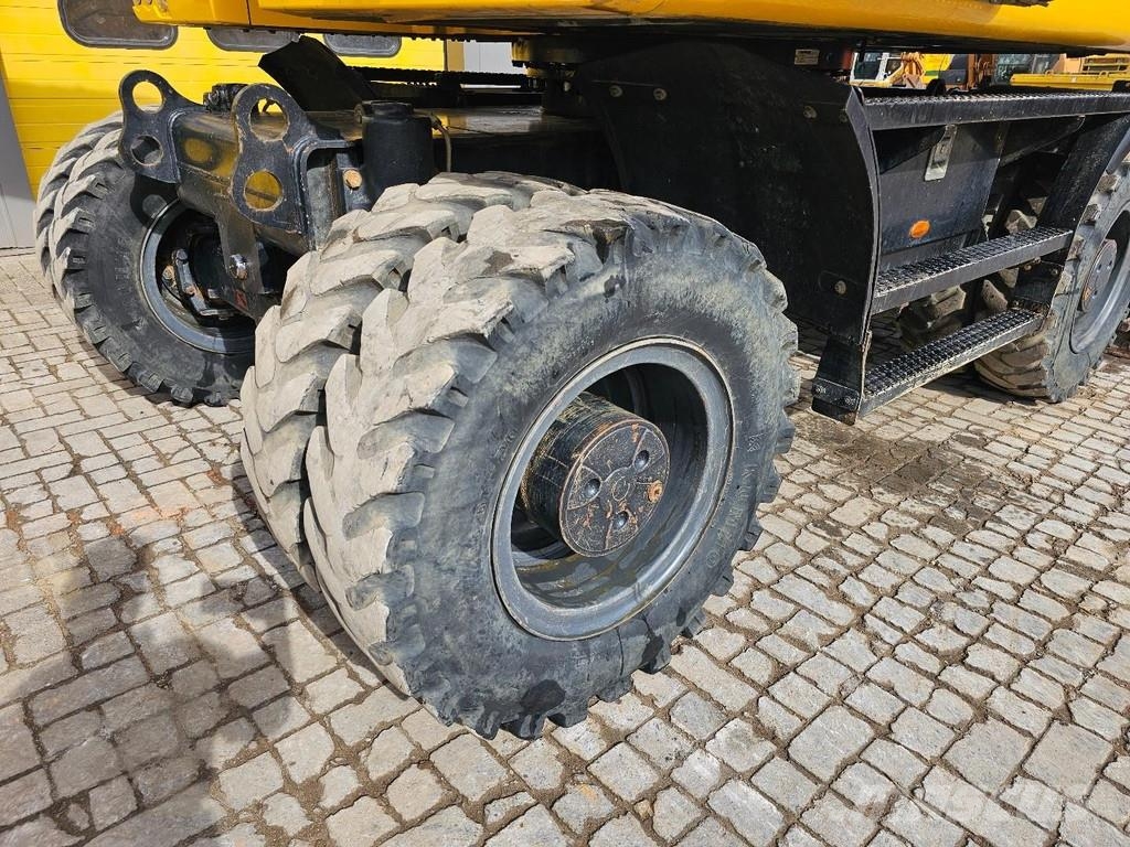 CAT M315F حفارات بعجل