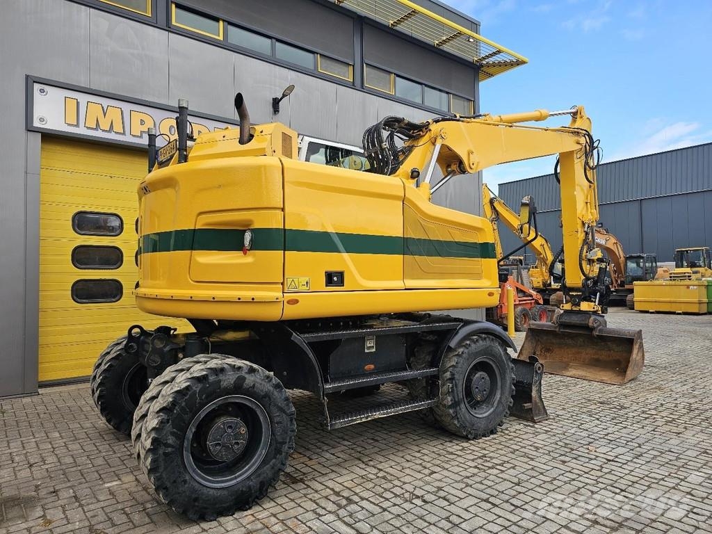 CAT M315F حفارات بعجل