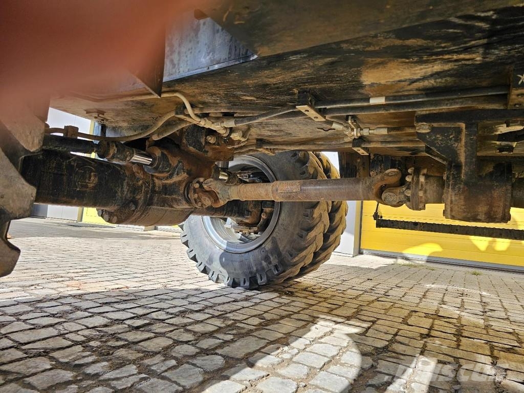 CAT M315F حفارات بعجل