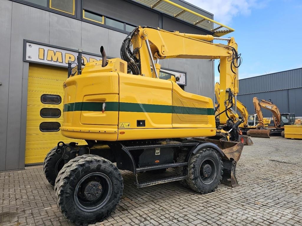 CAT M315F حفارات بعجل