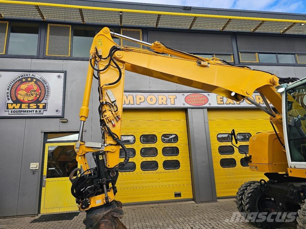 CAT M315F حفارات بعجل