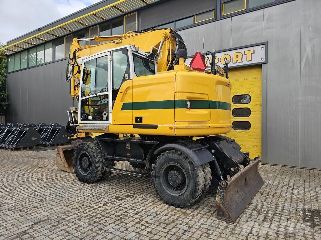 CAT M315F حفارات بعجل