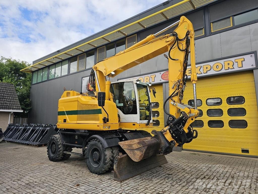 CAT M315F حفارات بعجل