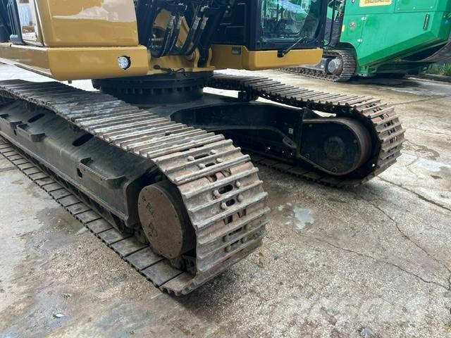 CAT 323 Rupsgraafmachines