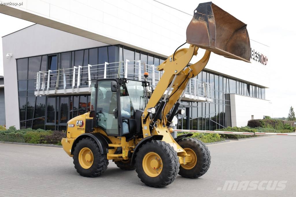 CAT 908M لوادر بعجل