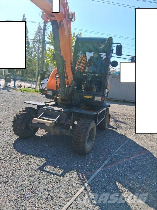 Doosan DX 55 W حفارات بعجل