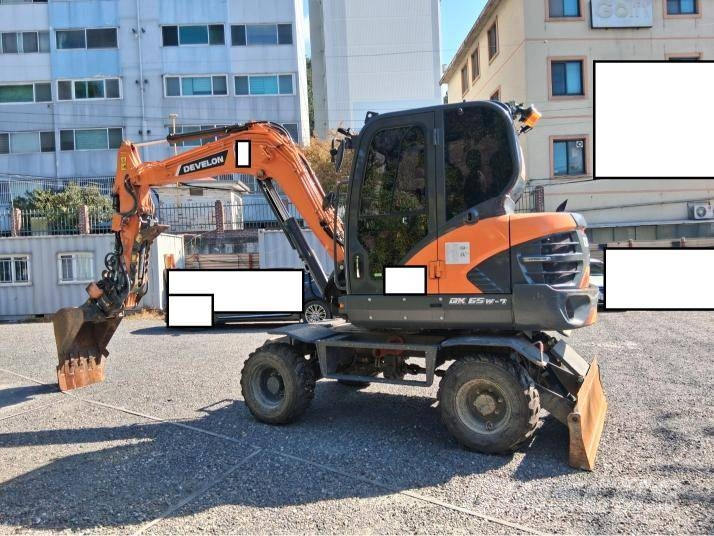 Doosan DX 55 W حفارات بعجل