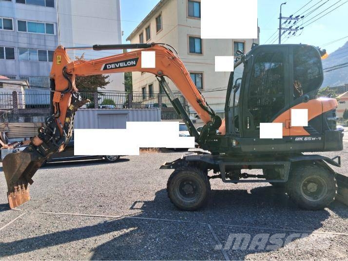 Doosan DX 55 W حفارات بعجل