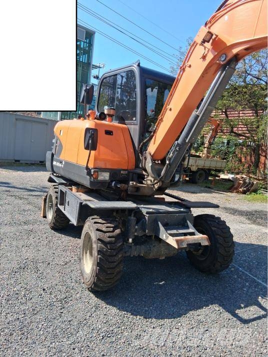 Doosan DX 55 W حفارات بعجل
