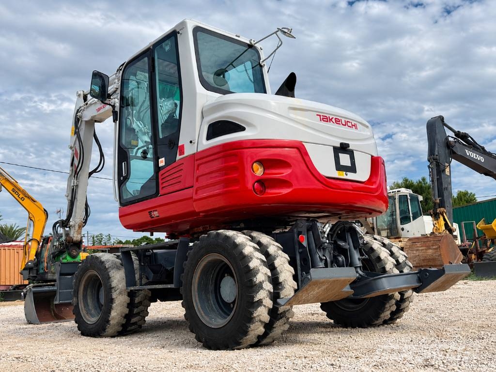 Takeuchi TB 295 W حفارات بعجل