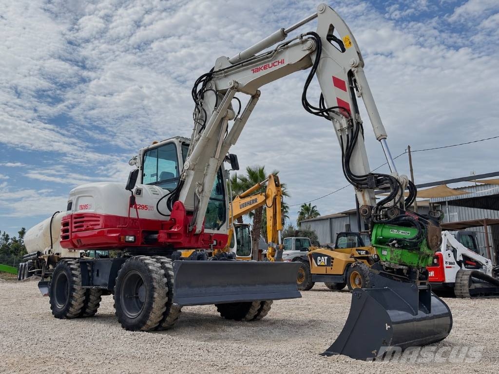 Takeuchi TB 295 W حفارات بعجل