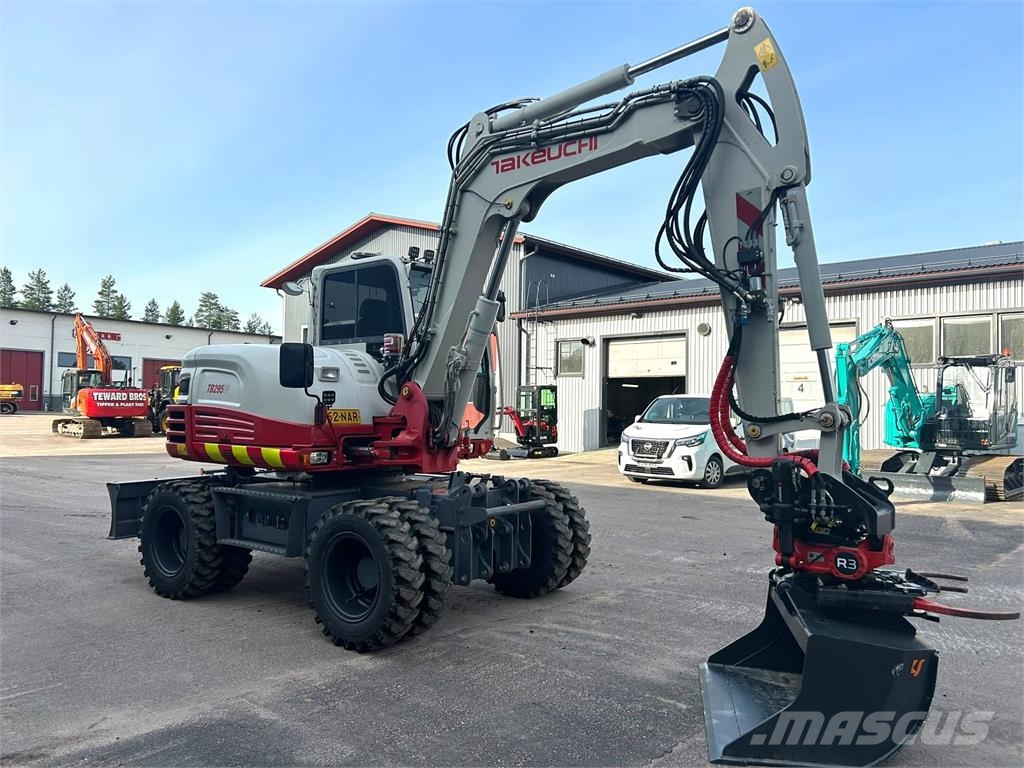 Takeuchi TB295W PYÖRITTÄJÄLLÄ Excavadoras de ruedas