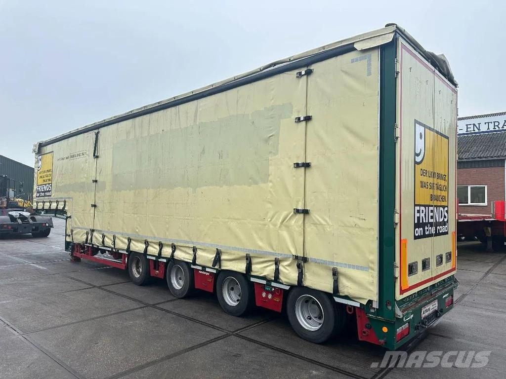 Meusburger 4 AXLE STEERING - DOUBLE EXTENDABLE UP TO 28 M - E نصف مقطورة مسطحة منخفضة