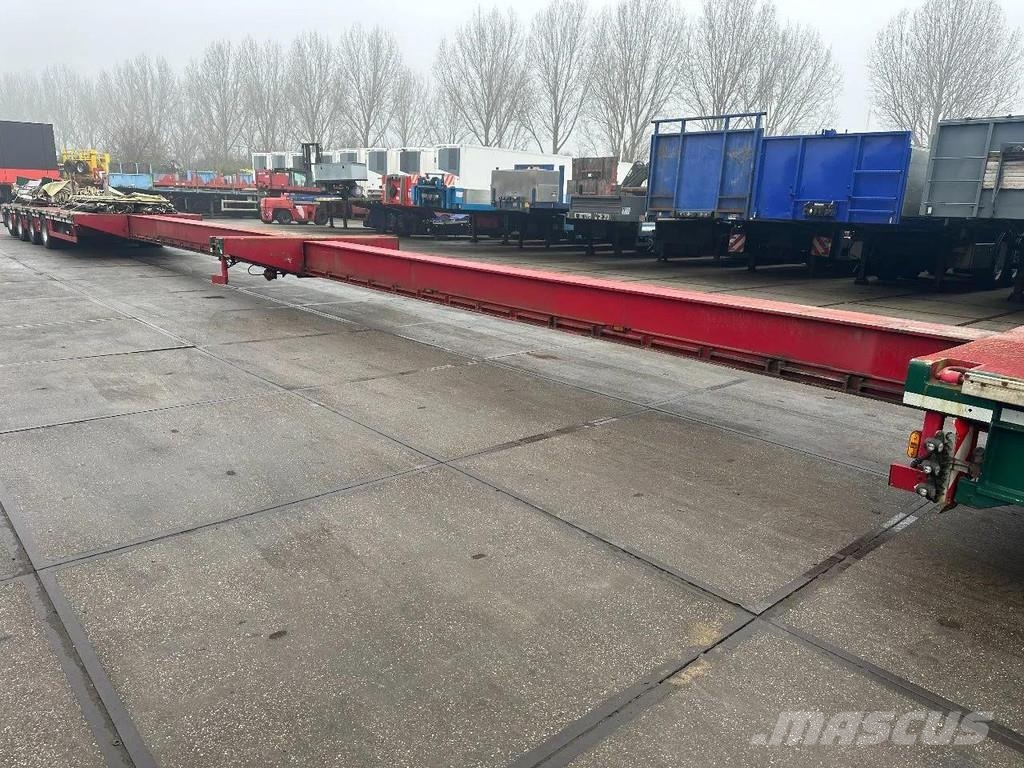Meusburger 4 AXLE STEERING - DOUBLE EXTENDABLE UP TO 28 M - E نصف مقطورة مسطحة منخفضة