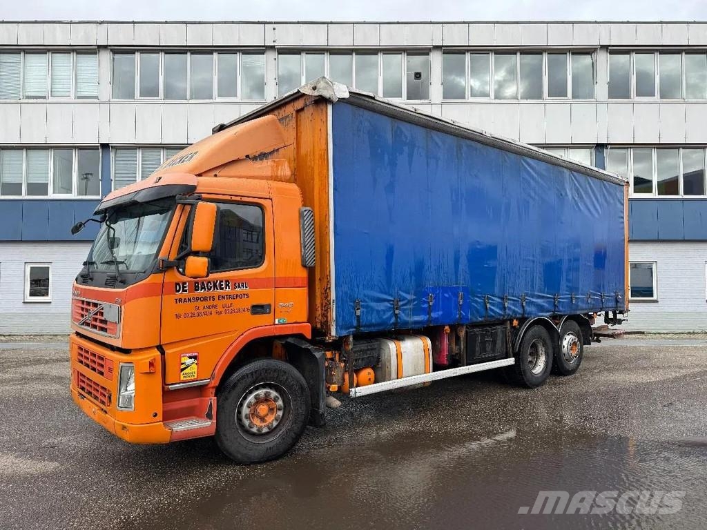 Volvo FM 340 6X2 DHOLLANDIA 2000 KG CURTAINS Camión con caja abierta