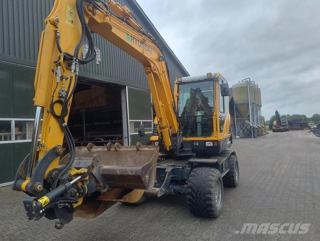 Hyundai ROBEX 55W-9A Banden kraan Ekskavatori uz riteņiem