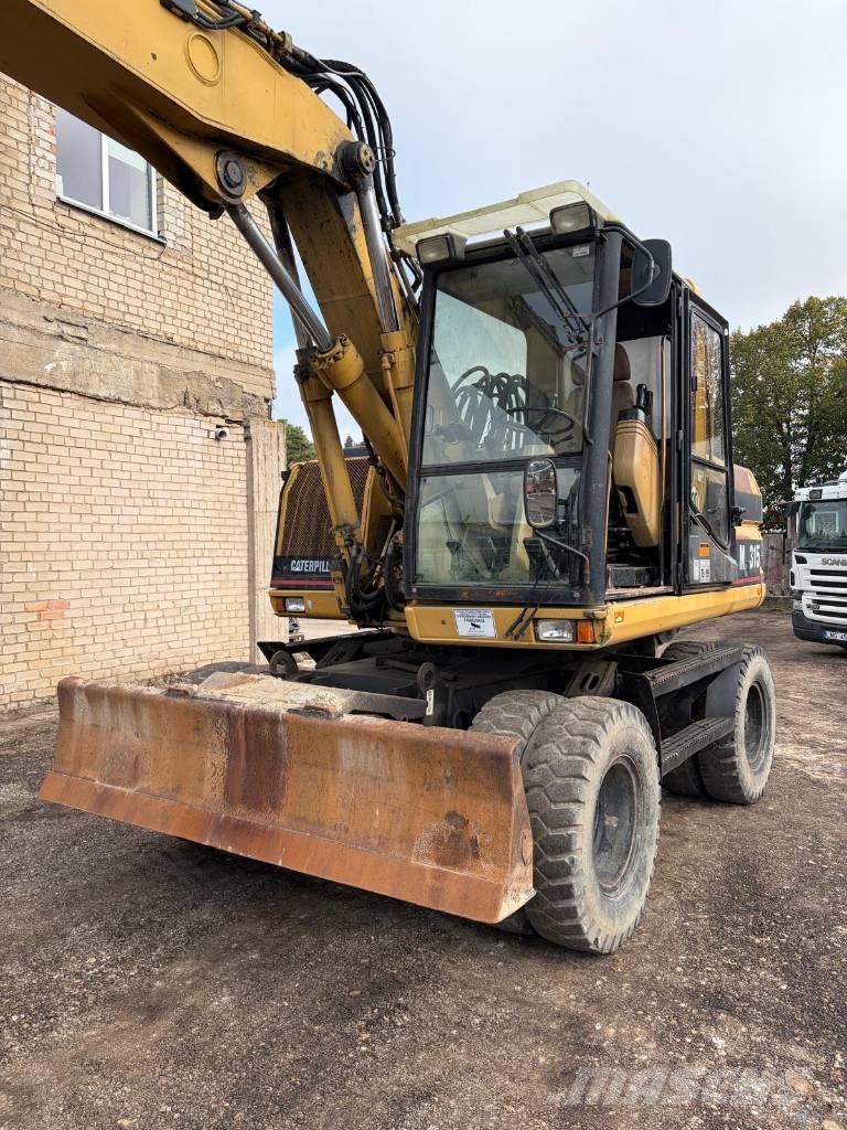 CAT M 315 Bagri na kolesih