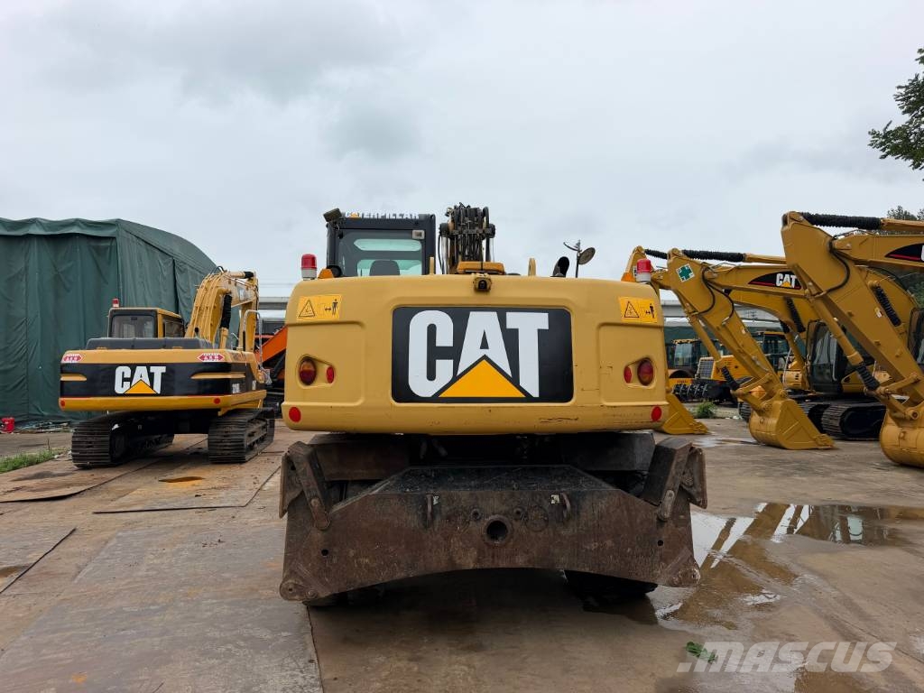 CAT M320D Bagri na kolesih
