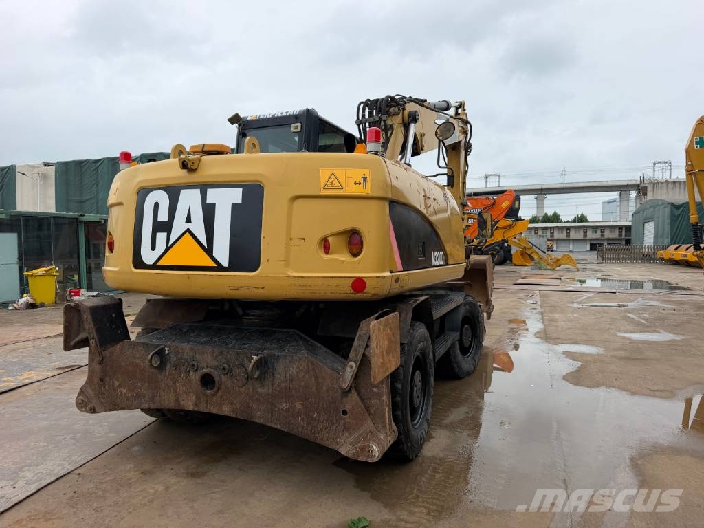 CAT M320D Bagri na kolesih