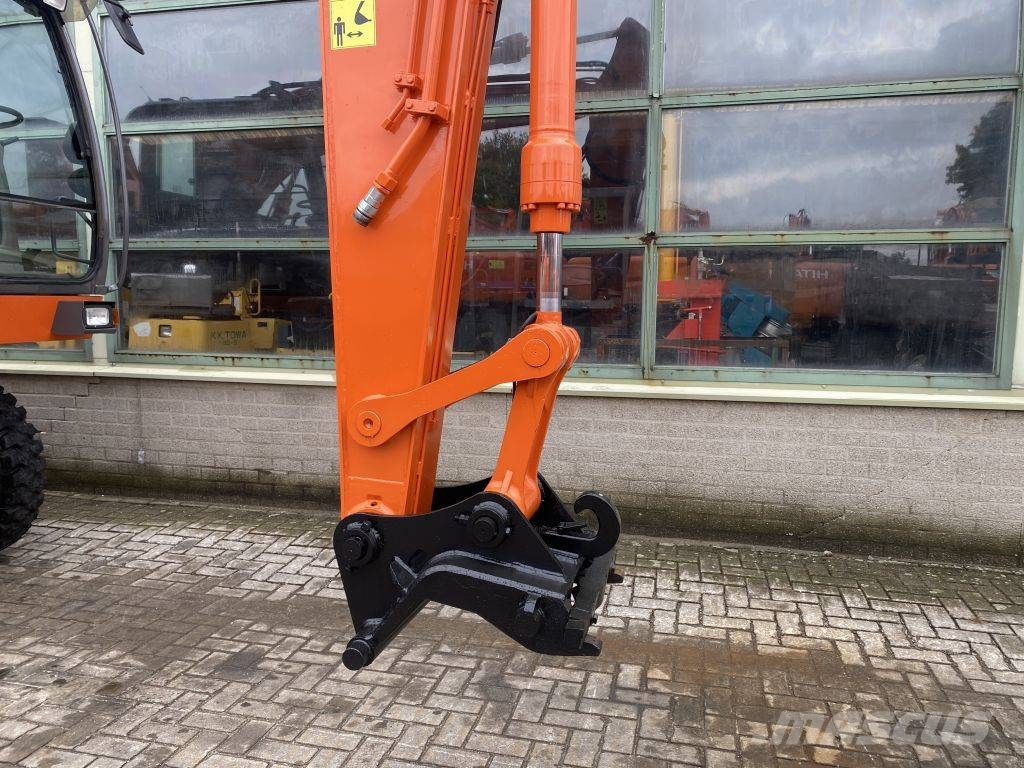 Hitachi ZX 140 W-3 حفارات بعجل