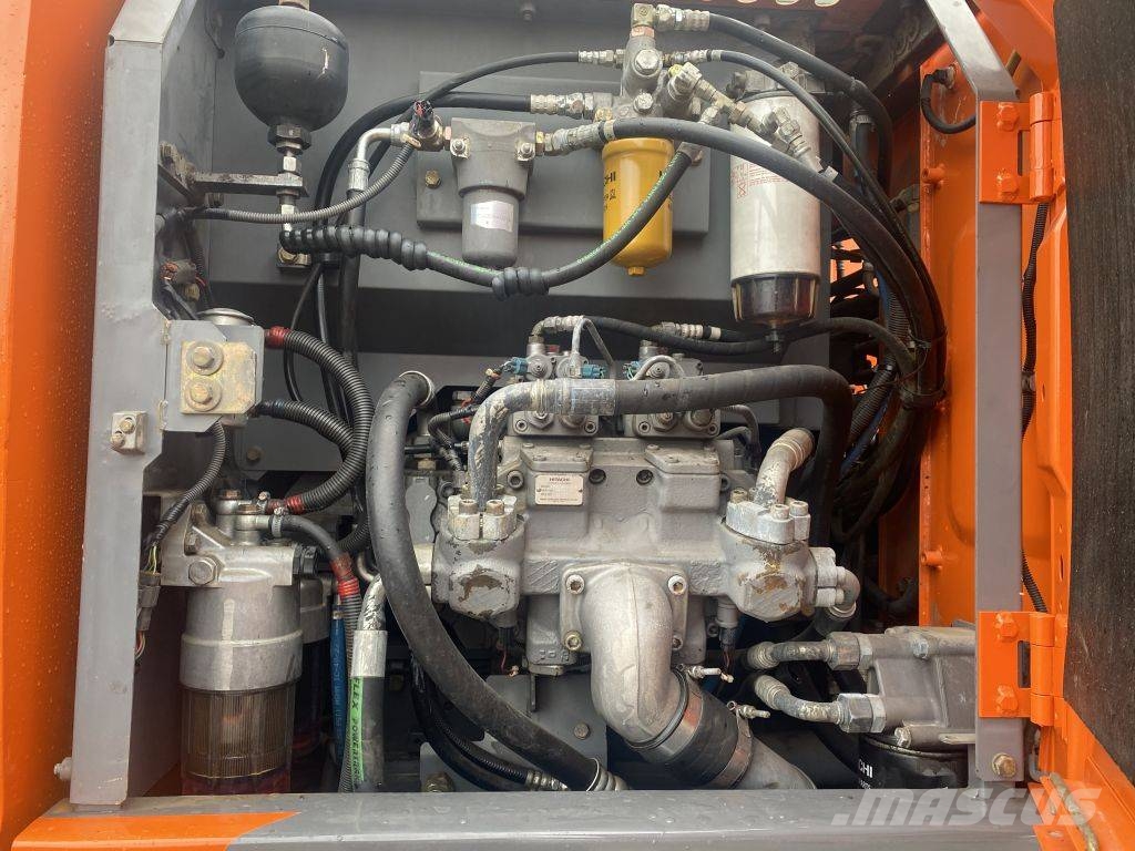 Hitachi ZX 140 W-3 حفارات بعجل