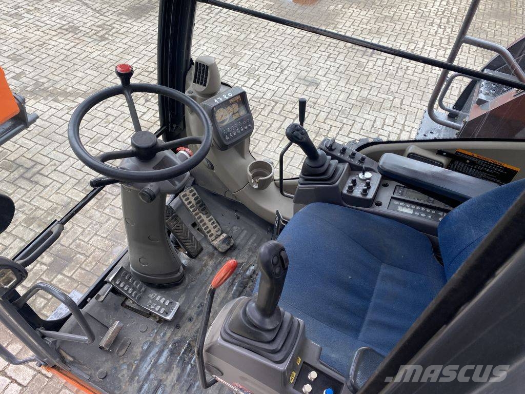 Hitachi ZX 140 W-3 حفارات بعجل