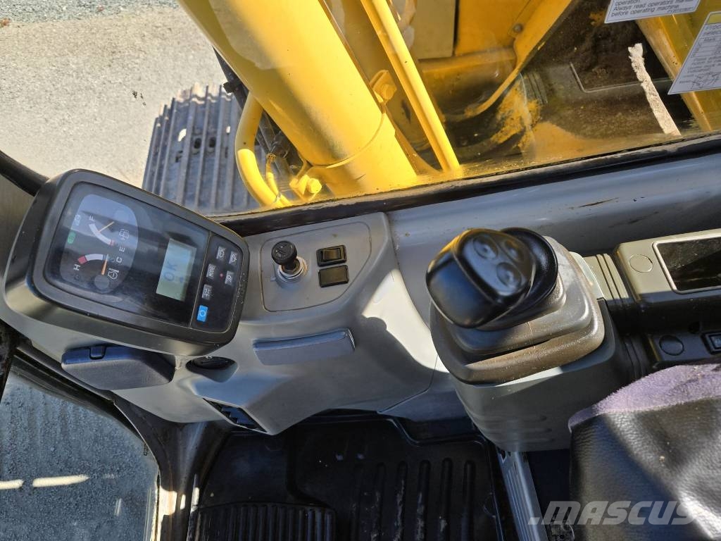 New Holland E 135 SR Bageri guseničari